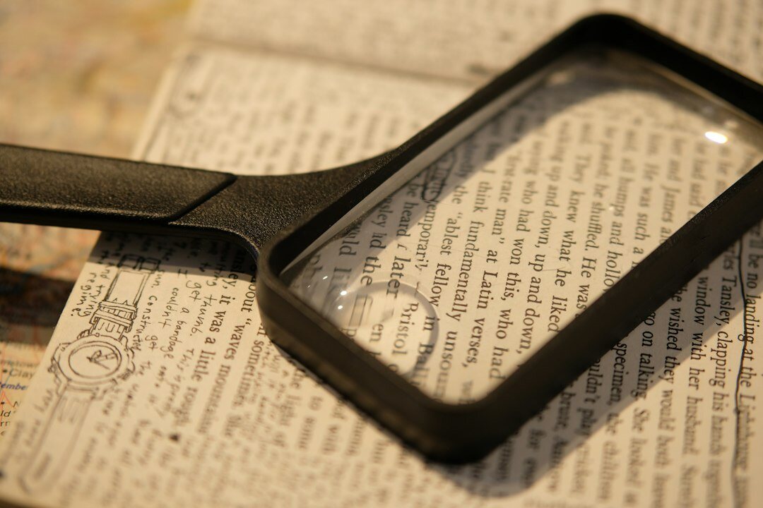 open book with magnifying glass